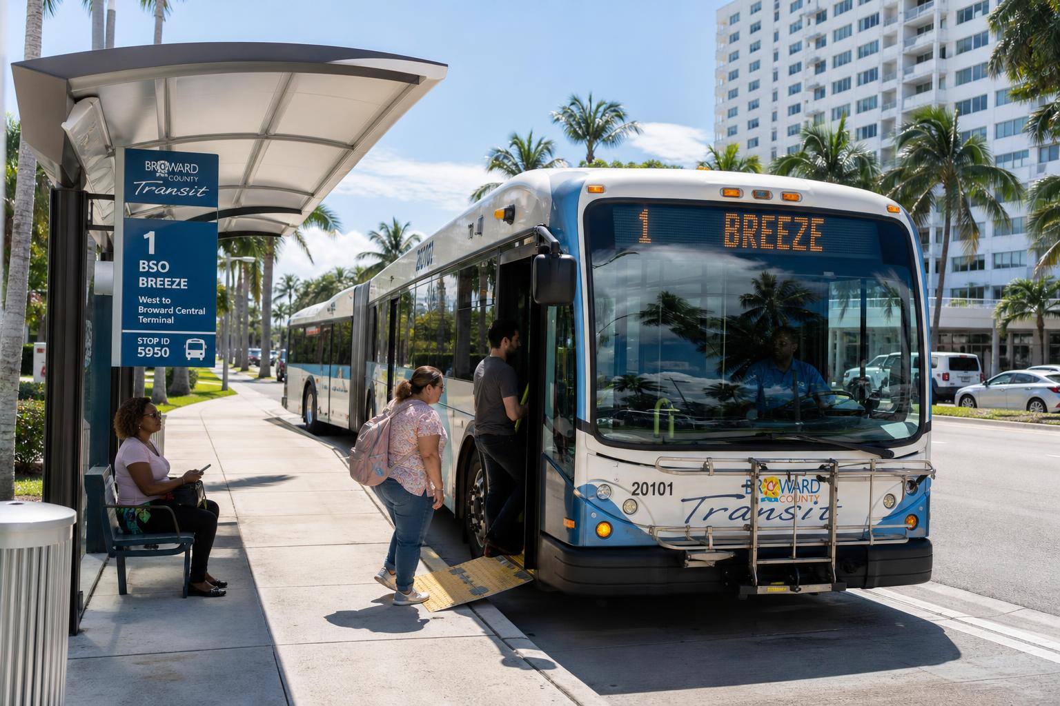 Representative modern city bus at an urban transit stop during daytime with clear sky