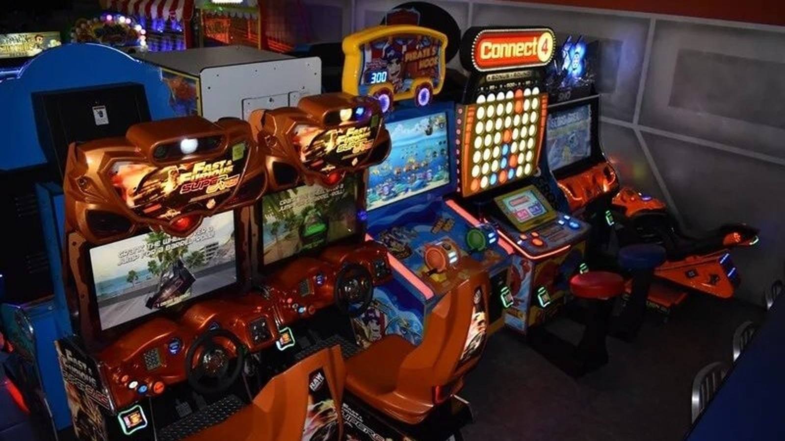 Rocket World indoor arcade with Fast & Furious racing games and colorful game cabinets in Pembroke Pines, Florida