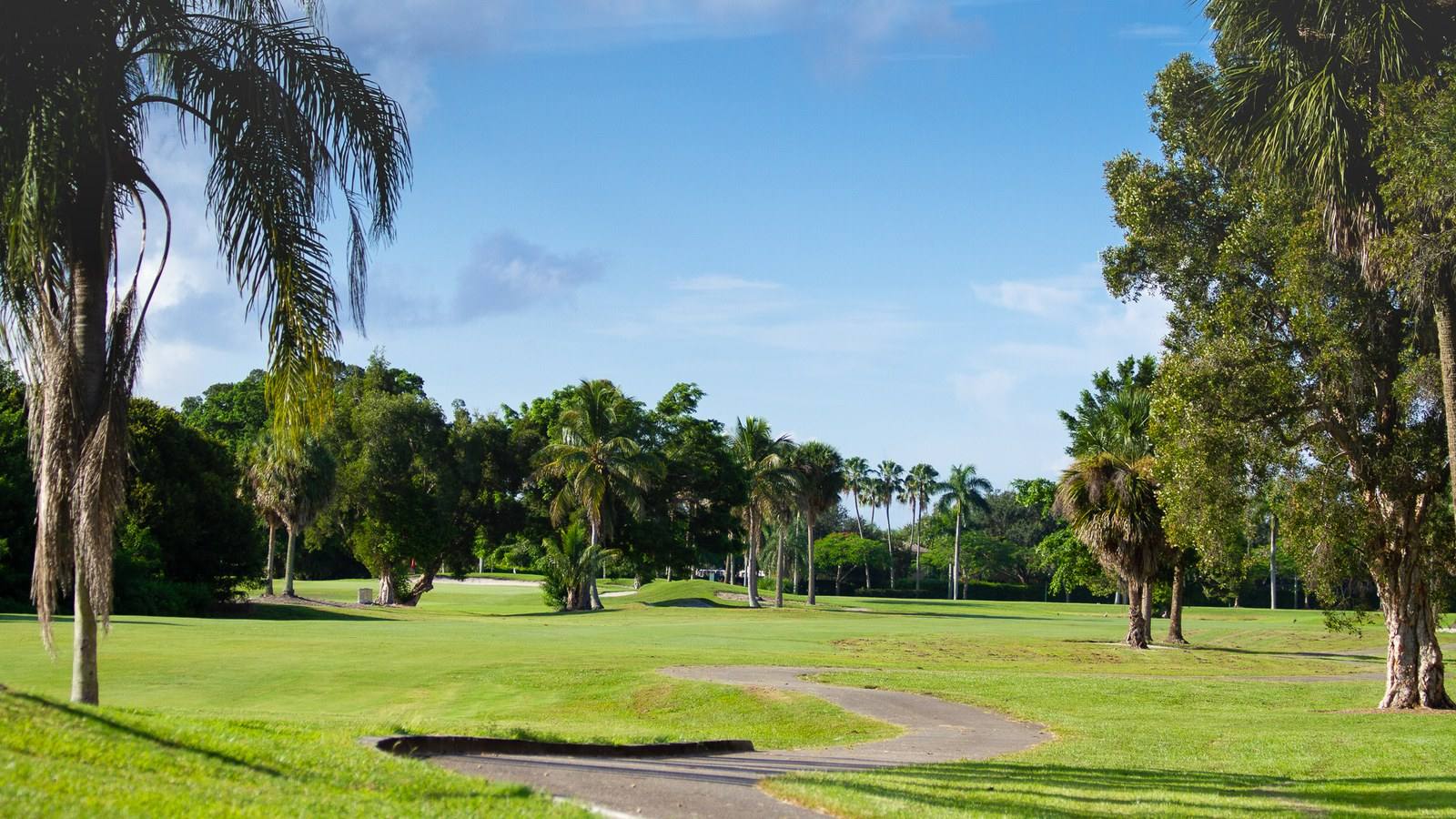 Championship golf course at Grand Palms Golf Resort with palm trees and lakes in Pembroke Pines