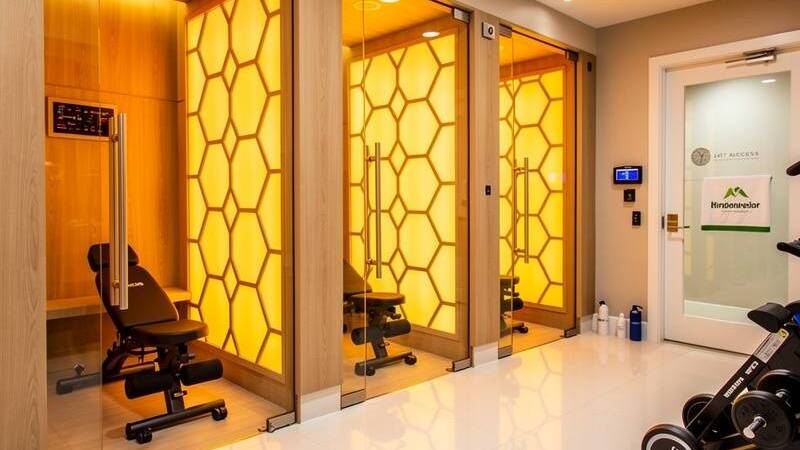 Representative infrared sauna fitness studio with warm amber lighting and modern pod design — editorial placeholder image, not an actual photo of this business
