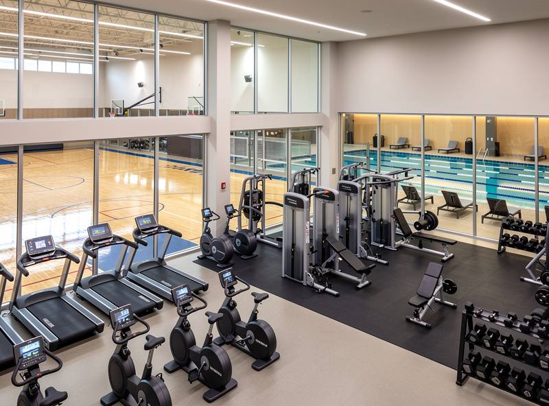 Representative full-service fitness center interior with cardio equipment, free weights, and weight machines — editorial placeholder image, not an actual photo of this business