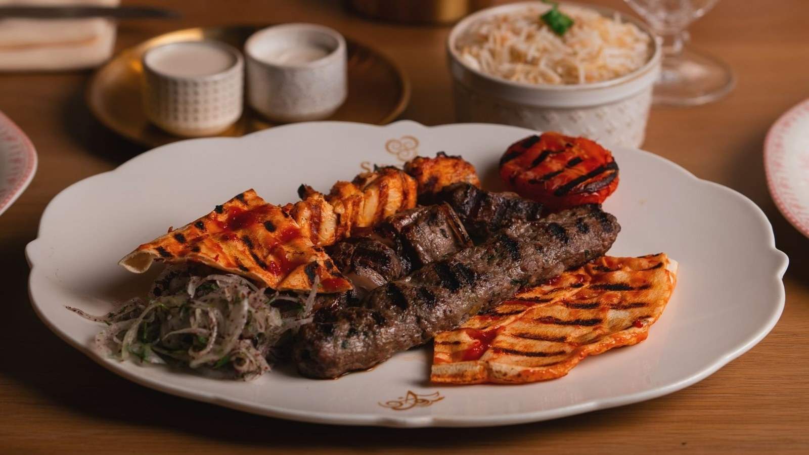 Sirocco Mediterranean Restaurant & Lounge — stylish dining room with warm lighting, plush seating, and modern Mediterranean ambiance at Pembroke Pines