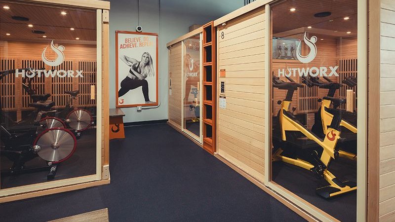 HOTWORX — infrared sauna training pods with exercise bikes (official facility photo from hotworx.net)